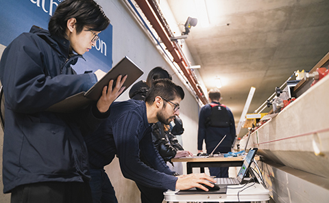 Students looking at computer.