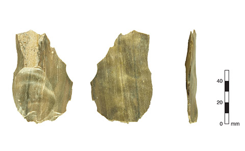 A flint hand tool seen from three different angles.
