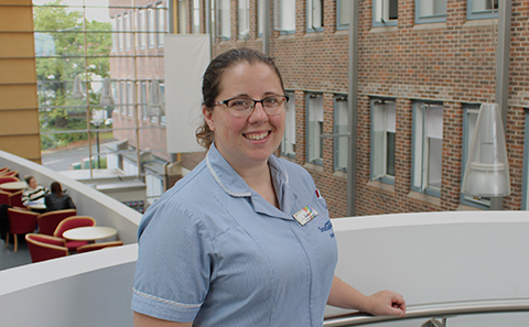 Woman in nurse uniform smiling