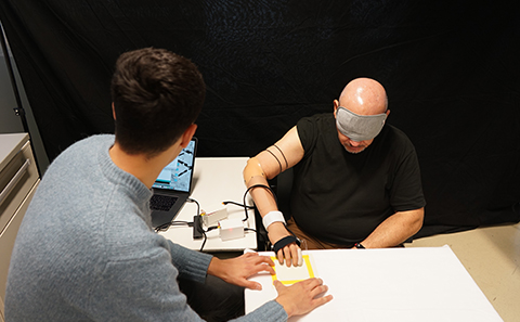 Two men in a lab testing room