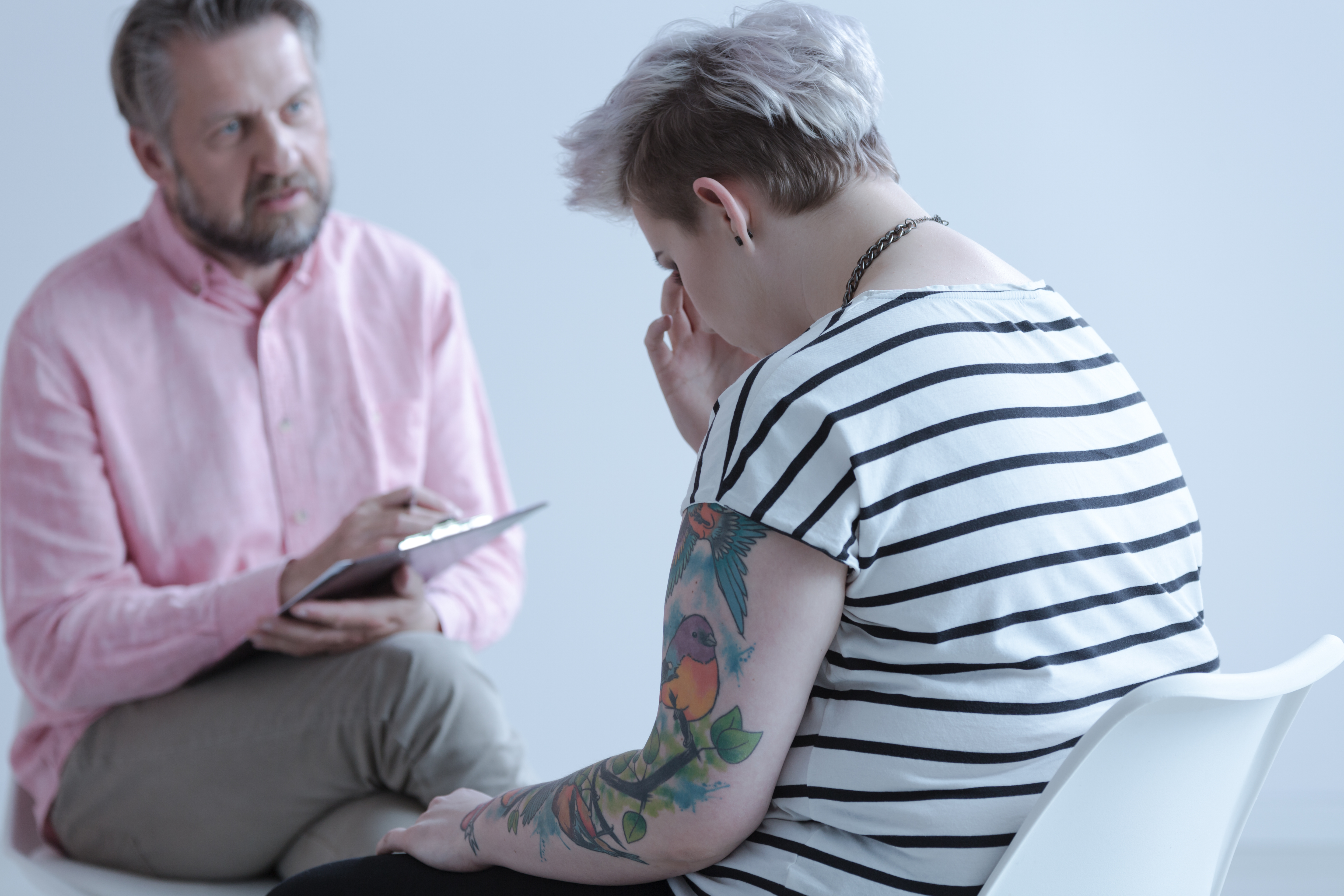 Teenage girl seeking support from counsellor