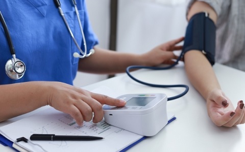 Patient having blood pressure taken