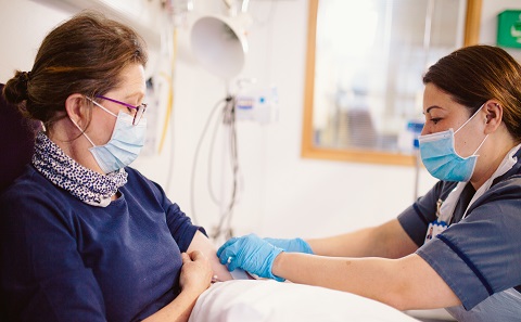 Patient being treated by a nurse