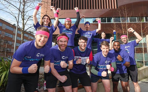 SCTU runners with their arms raised in celebration