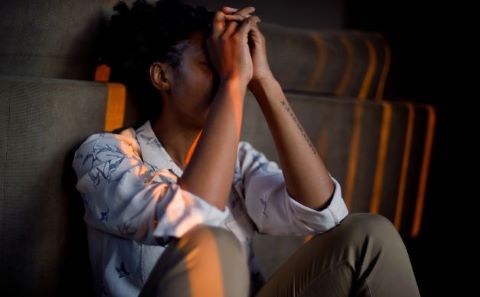 Person with head in their hands