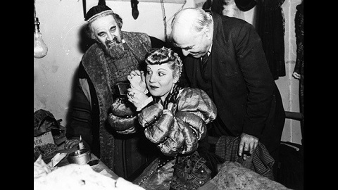 Meier Tzelniker (as Shylock) and his daughter Anna Tzelniker (as Portia), with director Robert Atkins in their dressing room at Adler Hall.