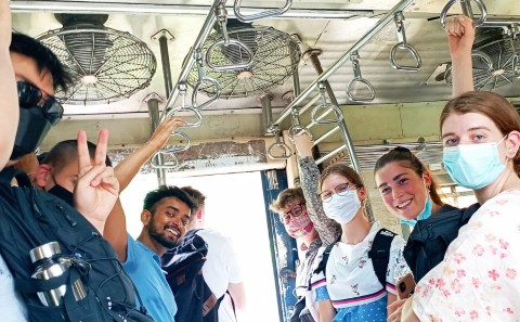 Students taking a train in Mumbai