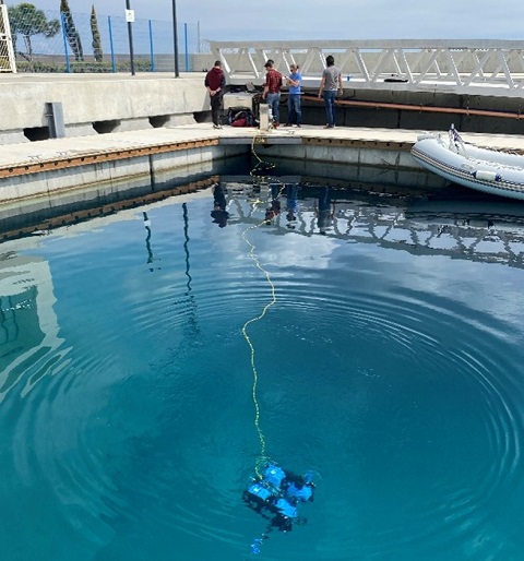 Researchers testing a ROV in a marina