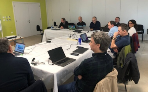 Group of people attending a workshop in a classroom