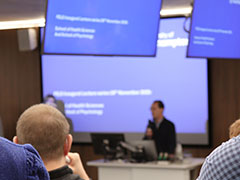 2025-26 lecture series with presenter talking to group