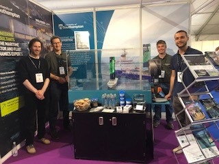 The UoS team showcasing opportunities and expertise at our stand, featuring the Winds of Change interactive wind tunnel