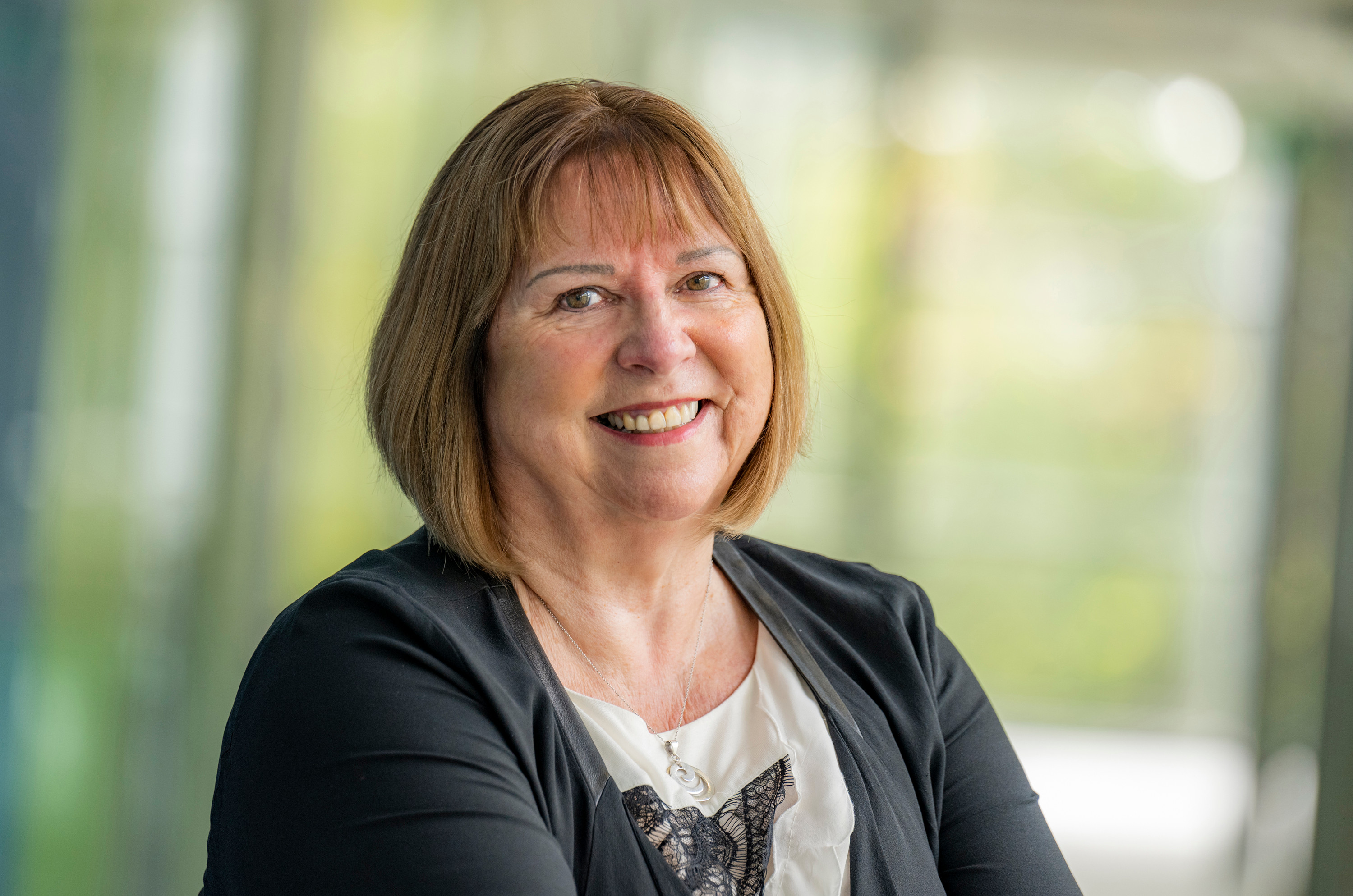 Dame Wendy Hall smiling and looking at camera