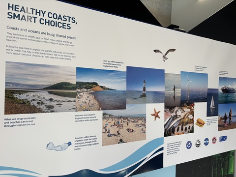 Informational poster displaying several pictures showing coastal landscapes. Pictures are placed longitudinally below the title reading ’Healthy coasts, smart choices’ and a explanatory text.