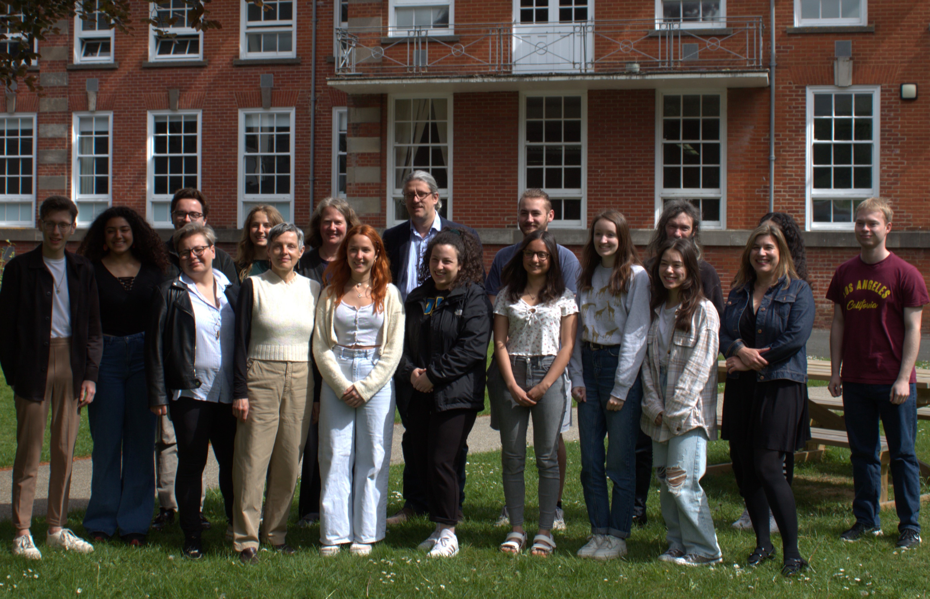 The German department staff standing outside the University building