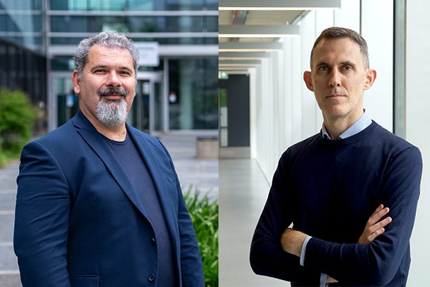 A split-screen image displays two men. On the left, a man with a graying beard is wearing a dark blue blazer over a dark shirt, standing outdoors in front of a modern glass building. On the right, a man with short brown hair is wearing a dark navy blue crew-neck sweater over a light-colored collared shirt, standing in a bright, modern indoor hallway with glass windows and overhead lights.