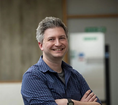Professor Hayward Godwin smiling at camera