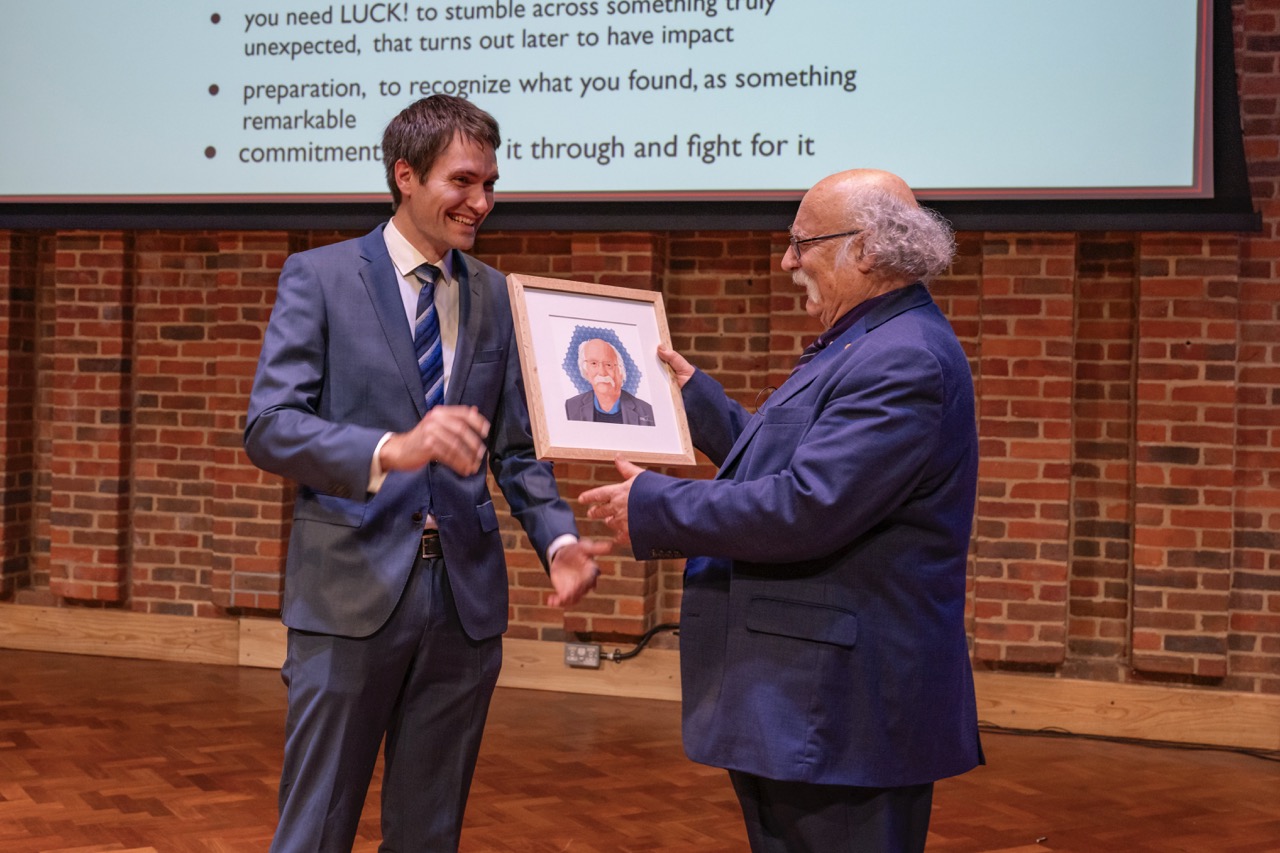 Dr Haehl is presenting a gift to Prof Haldane