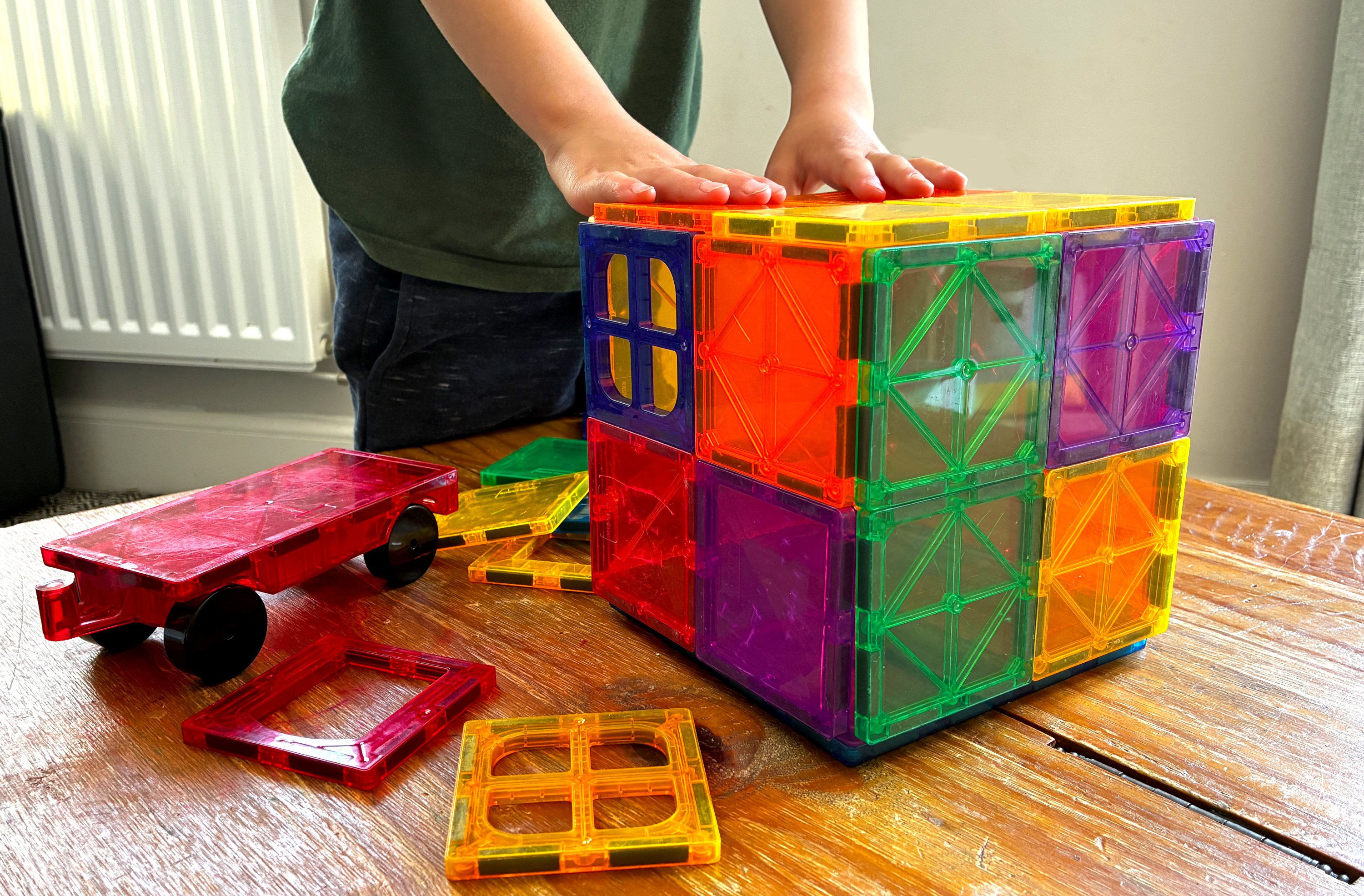 Children playing with popular magnetic toy tiles