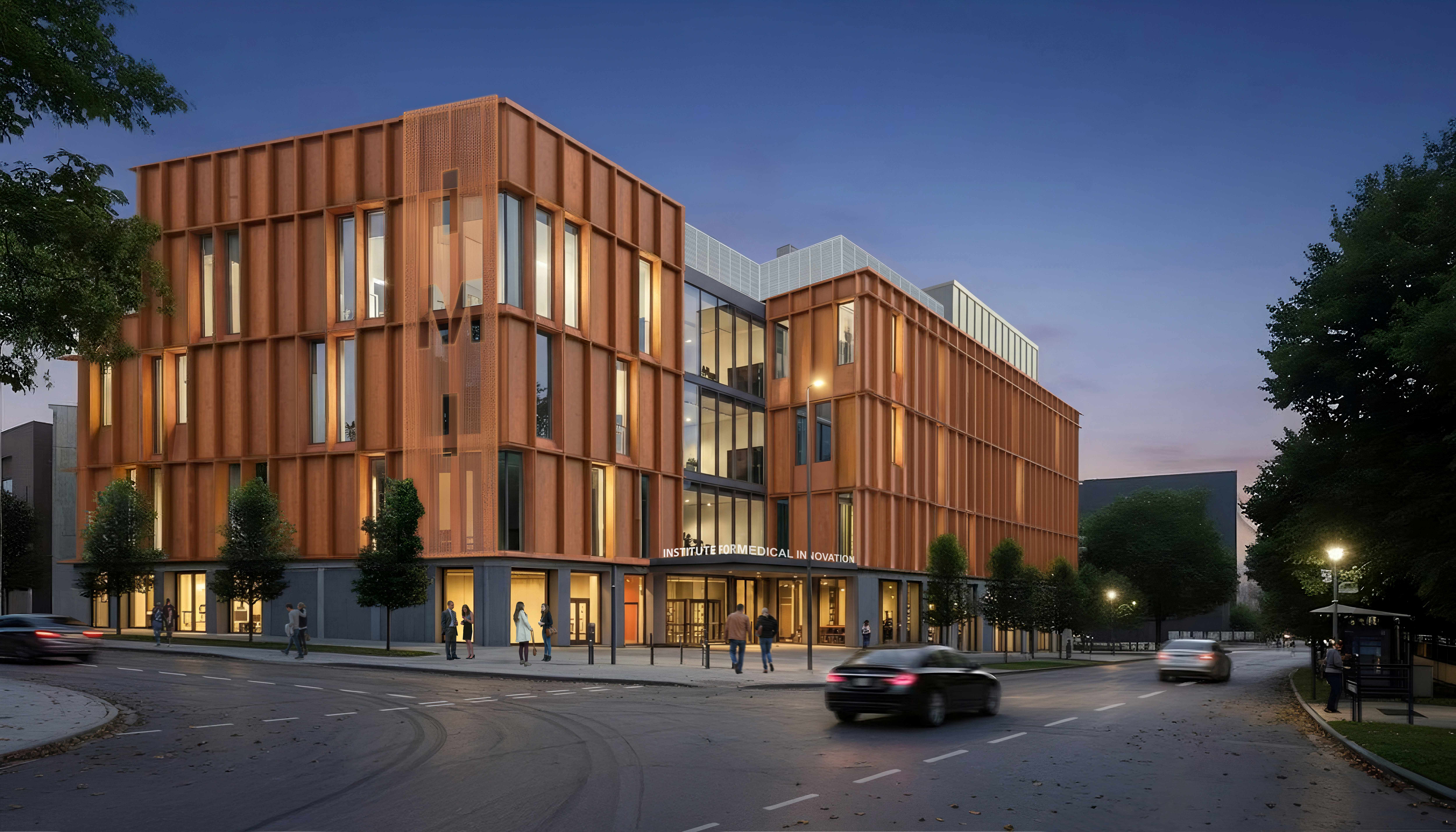 Modern Institute for Medical Innovation building at dusk, with facades, large windows, trees along the street, and people walking outside.