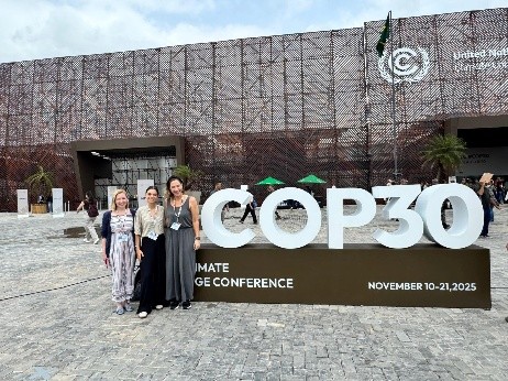 The InPlanet team at COP30 standing outside the conference building.