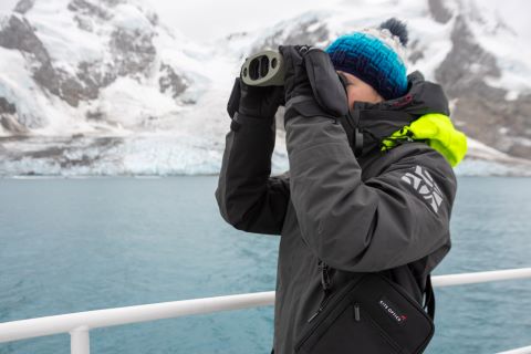 Julie Mestre looking for whales in the vicinity of Elephant Island, binocs courtesy of Kite Optics 