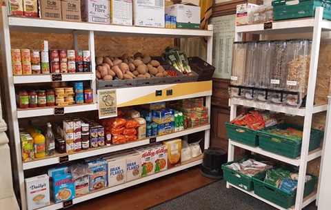 Shelves stacked with packets and boxes of food