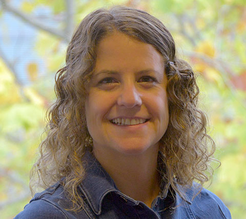 Professor Lyn Ellett smiling at camera