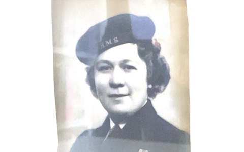 Black and white photo of a woman with short hair wearing a beret