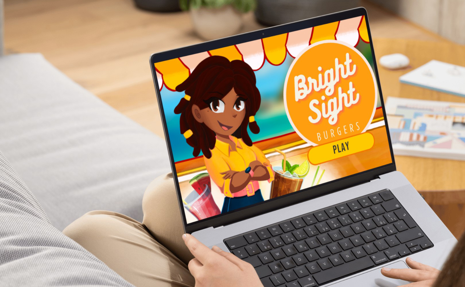 A cartoon girl with her arms folded showing on a laptop screen.