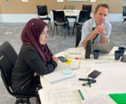 Ashra Khanom (L) and Jamie Mackay (R) in conversation with participants after their presentations.