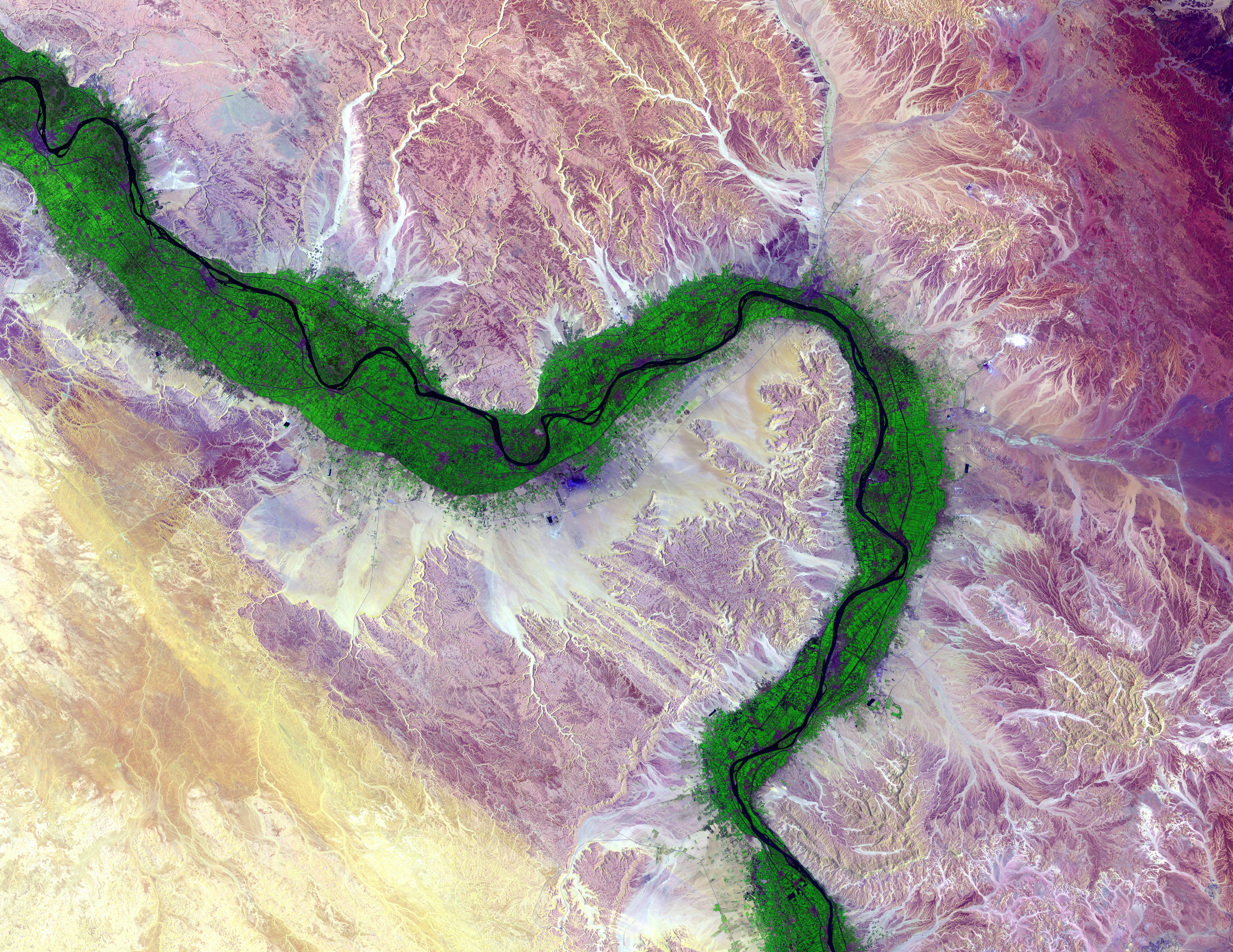 River Nile from space eclipsed by green farmland and surrounded by desert