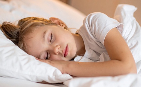 A young girl asleep peacefully