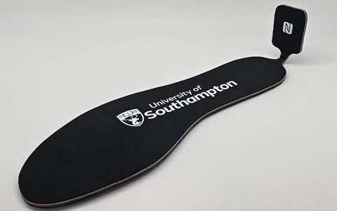 A black insole with a white University of Southampton logo printed on it