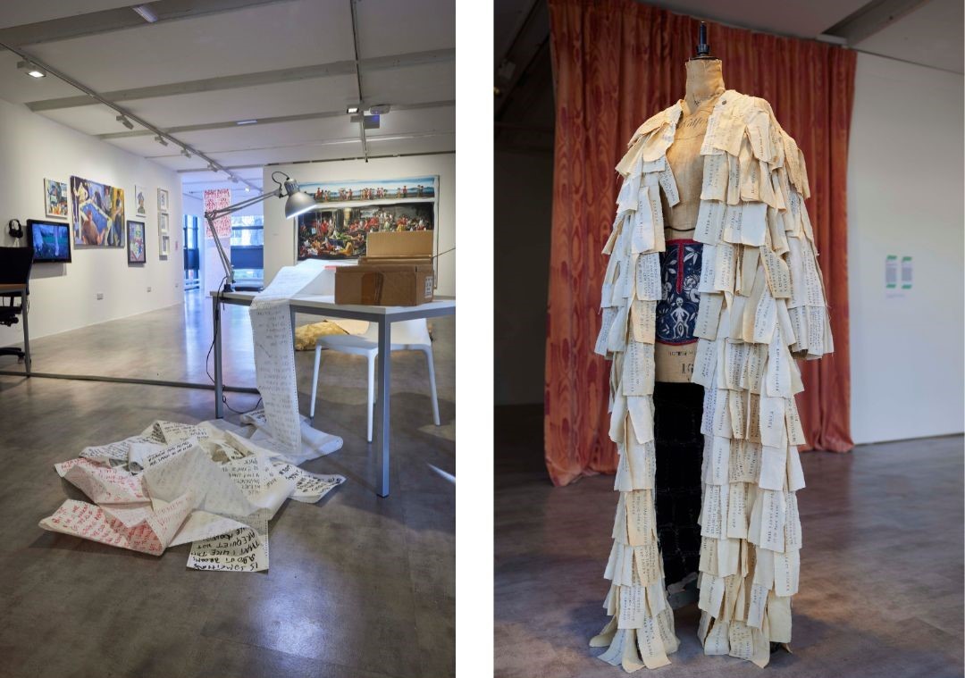 Left image: A table in a gallery has paper flowing from it into a pile on the floor. There is also a lamp and cardboard box on the table. Right image: A dressmaker's mannequin wears a long coat which appears to be made from rectangular pieces of fabric or paper. 