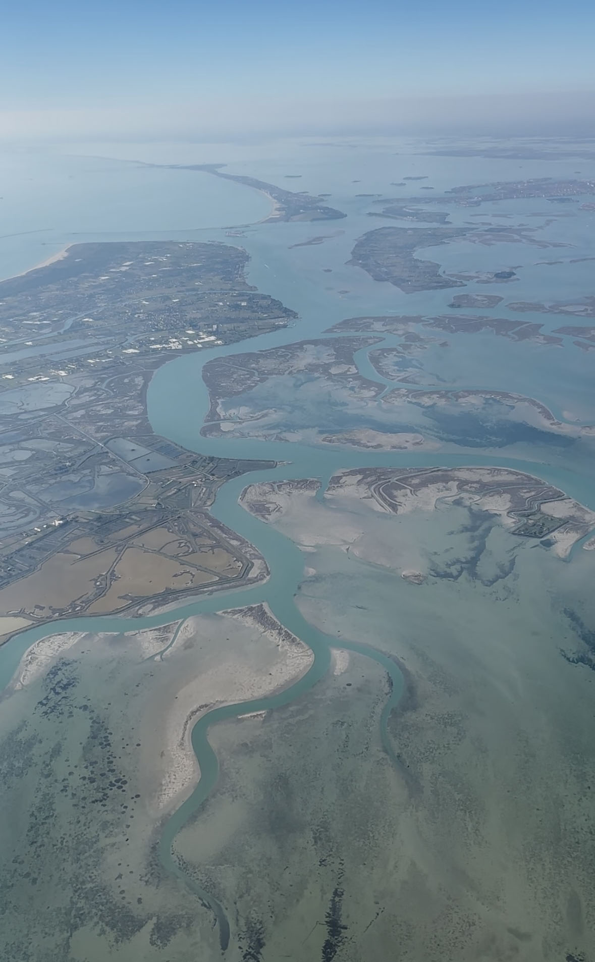 Aerial view across a lagoon with islands and coastal inlets