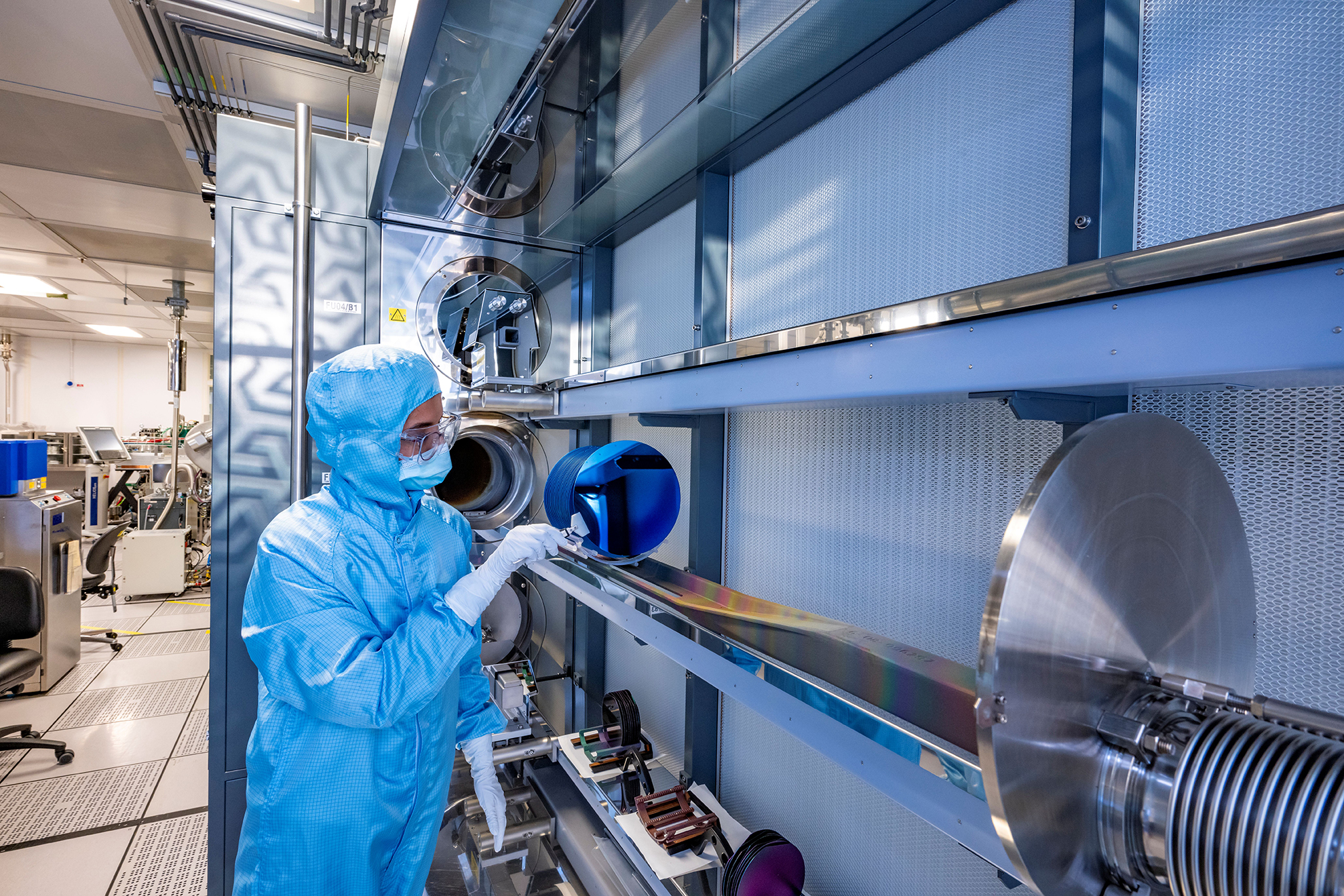 Researcher working in the Zepler Cleanrooms at the University of Southampton.