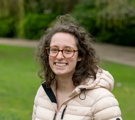 Head and shoulders portrait image of Maria Farmer smiling at the camera.
