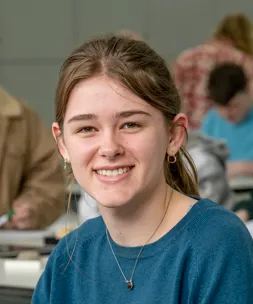 Head and shoulders portrait of Rebecca Jacques smiling at the camera.