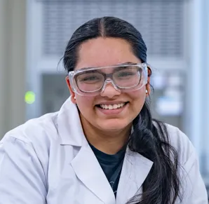 Head and shoulders portrait image of Sneha Shah smiling at the camera.
