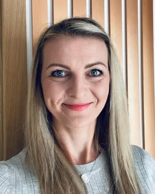 Portrait image of Tina Arnold smiling at the camera
