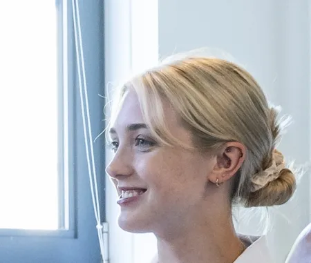 Head and shoulders portrait image of Eleanor Ryan, BSc Occupational Therapy student looking to the left of the camera.