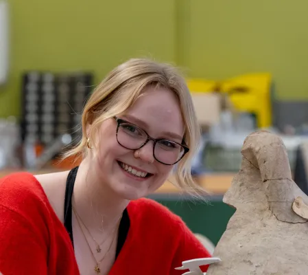 Head and shoulders portrait image of Rosemarie Elspass, BA Archaeology and Ancient History student, smiling at the camera.