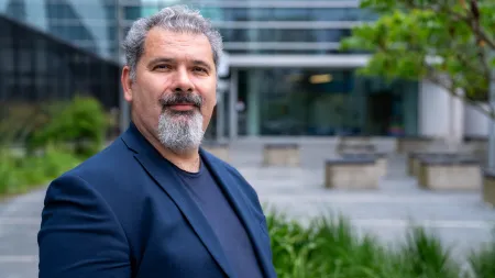 A close up shot of Professor Dimitrios Angelakis standing outside the Zepler building.