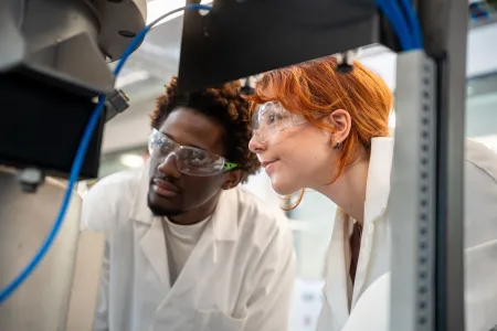 MEng Chemical Engineering students looking at equipment