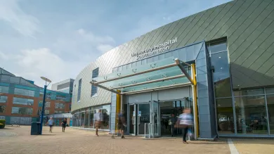 People coming and going outside the entrance of Southampton General Hospital.