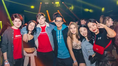 Group of happy fresher students at a nightclub.