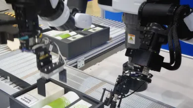 Robotic sensors packing products on a production line