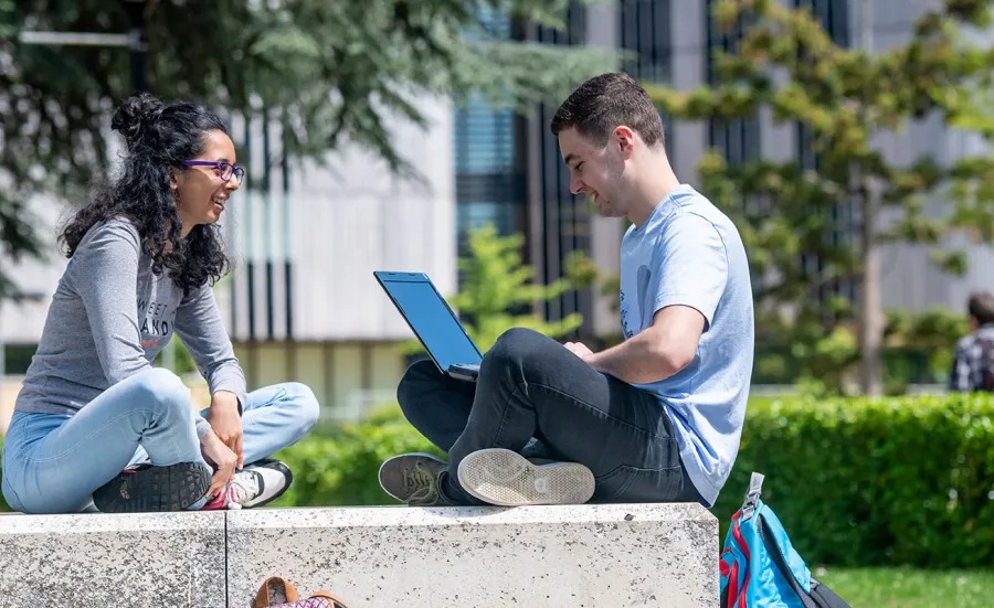 Students on computers on campus