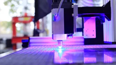 A pulsed fibre laser cutting through metal