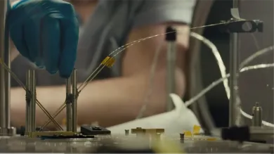 An Advanced laser laboratory researcher attending a fibre laser experiment
